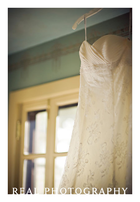 wedding dress hanging in boettcher mansion