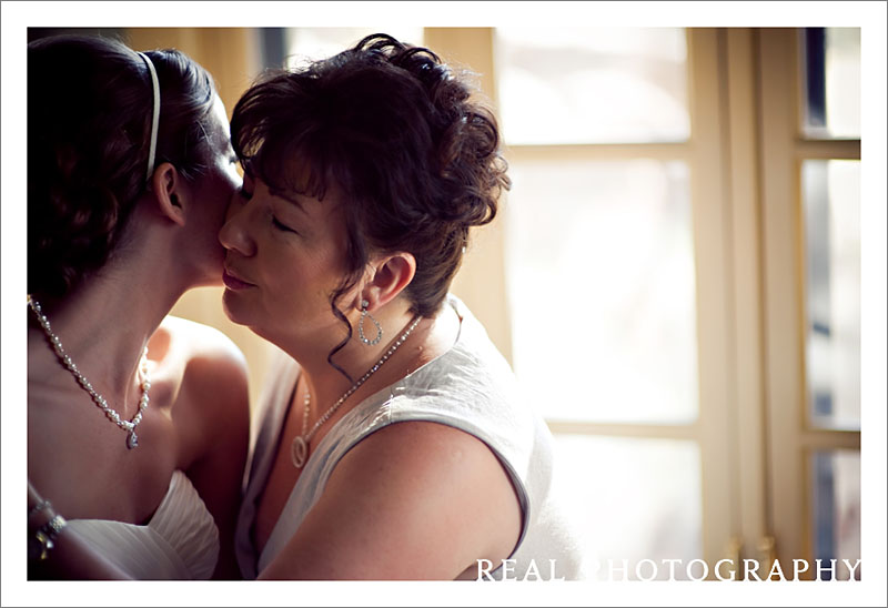 bride hugs mom getting ready