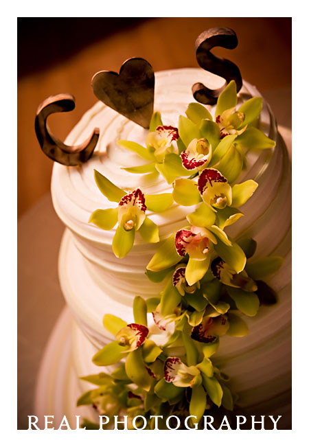 white wedding cake with green flowers