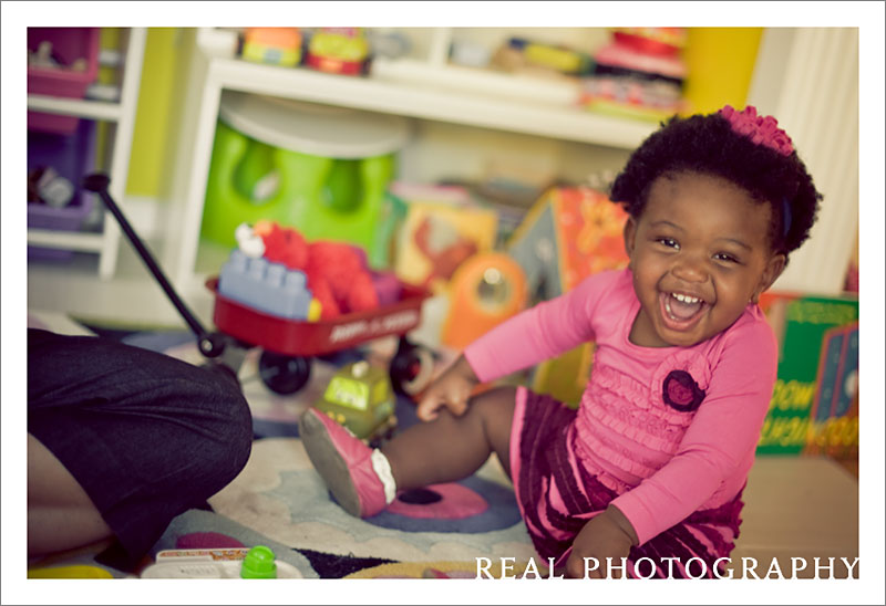 baby toddler laughing in play room natural family portraits