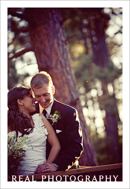 bride and groom at bridge at lodge at cathedral pines