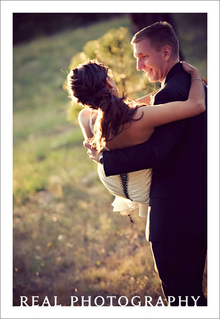 romantic bride and groom wedding portrait at sunset